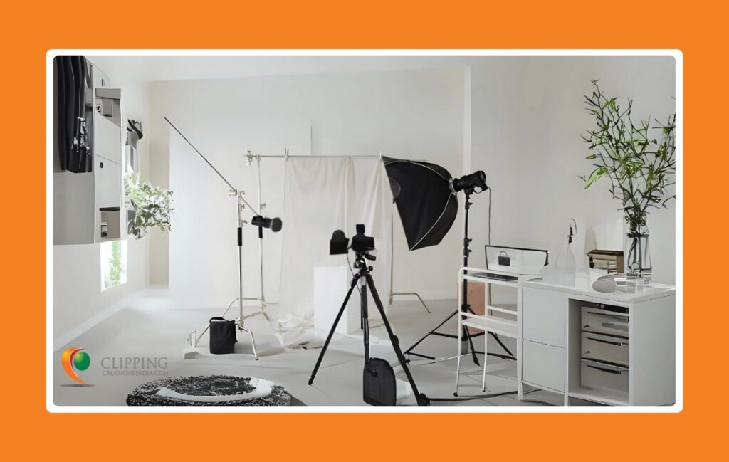 Photography studio featuring camera, tripod, backdrop, props